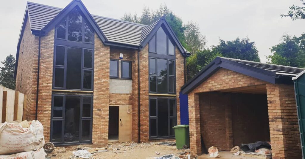 Modern new build house with a exterior garage in the building and development stage